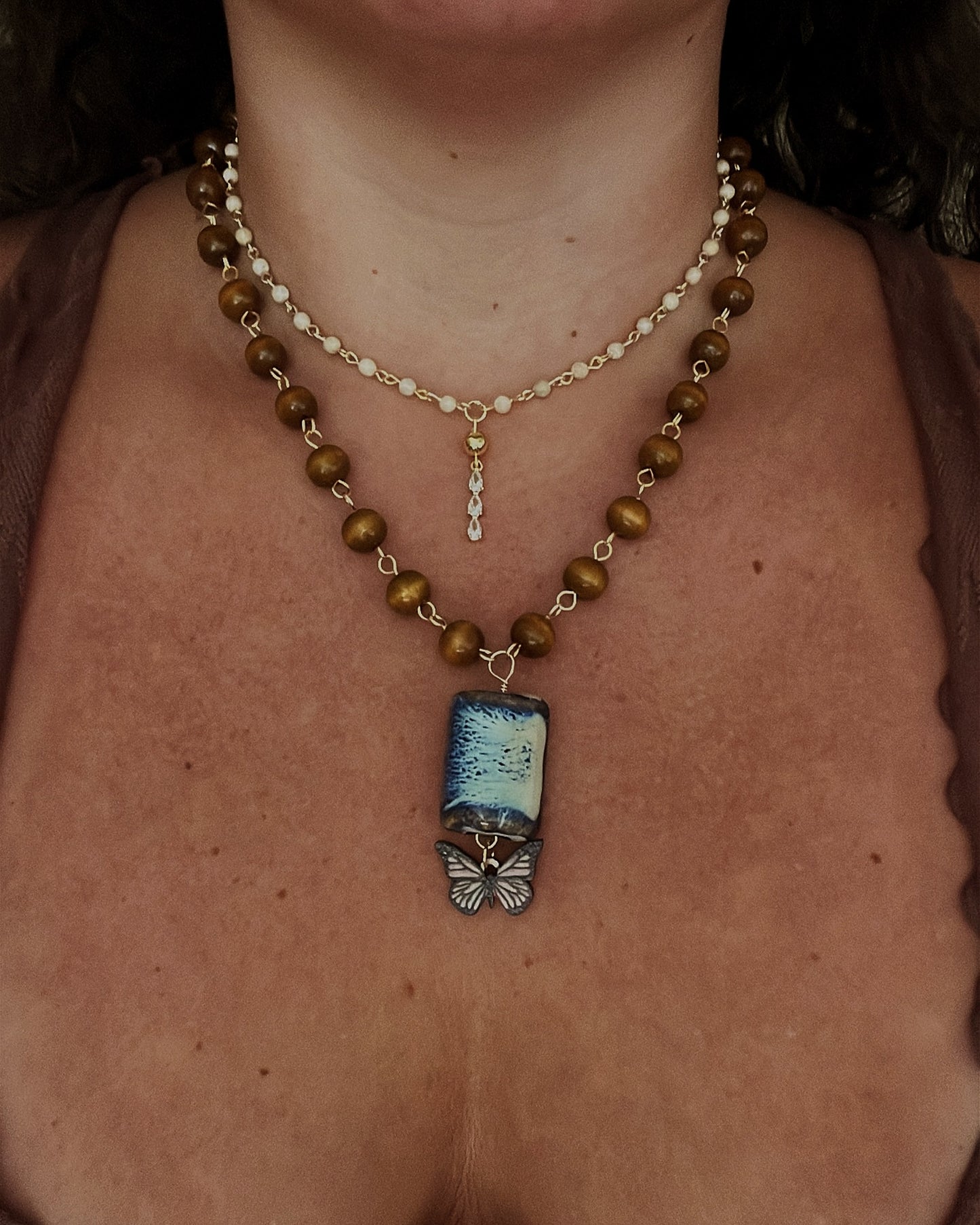 Blue/tan ceramic & butterfly necklace