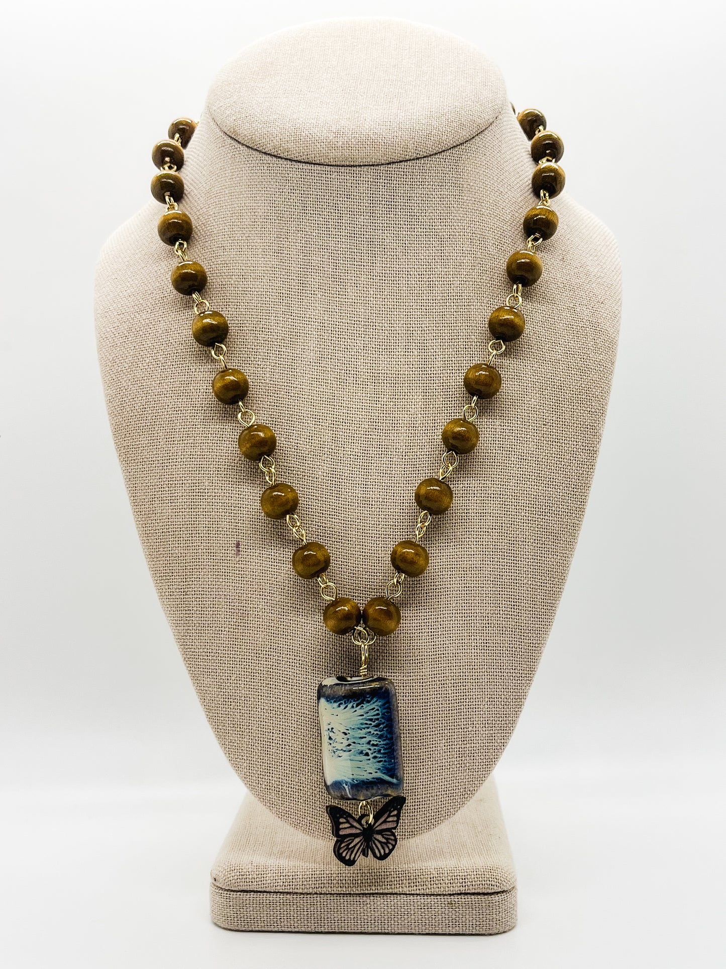 Blue/tan ceramic & butterfly necklace