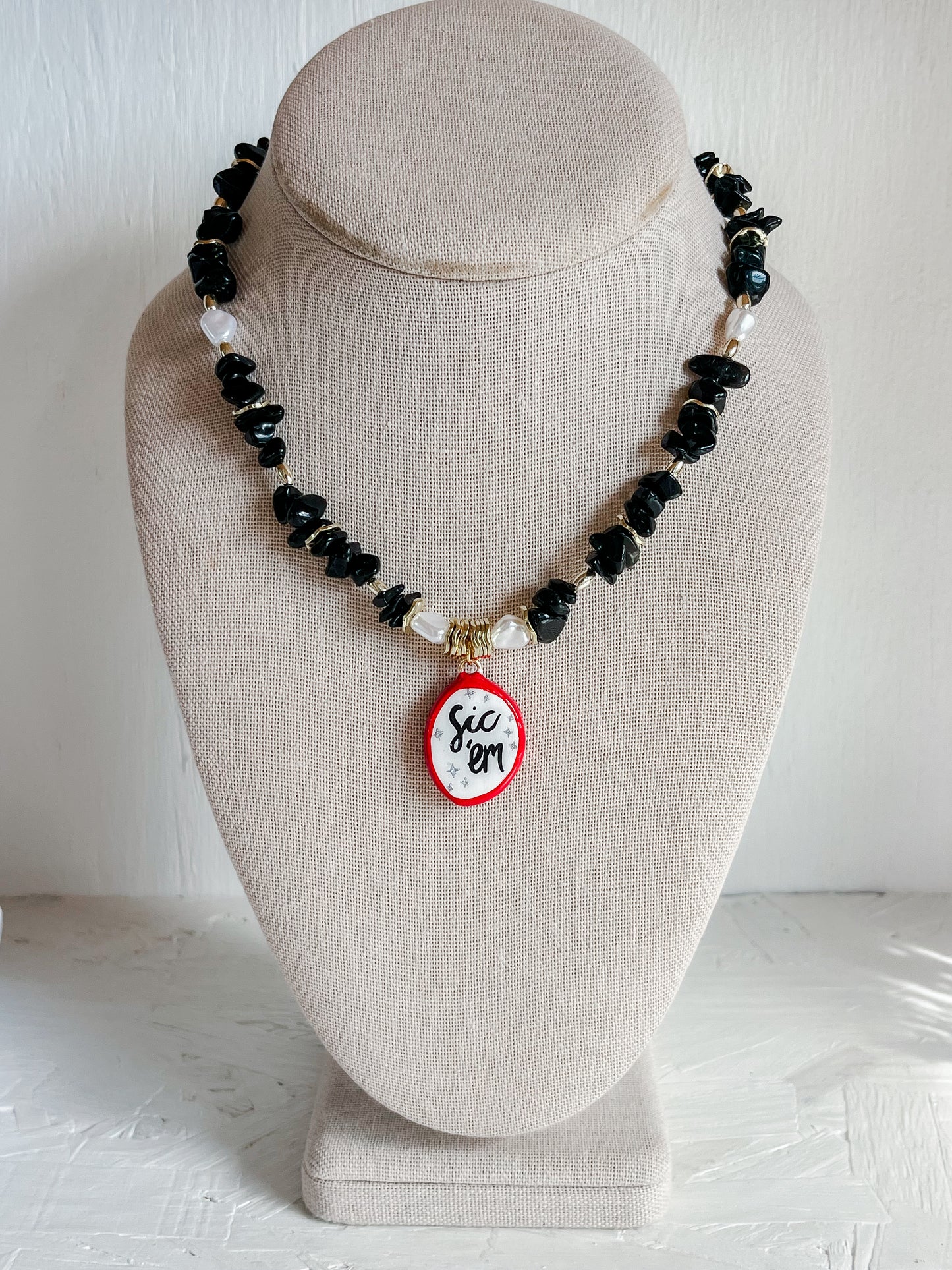 Black “Sic ‘em” necklace