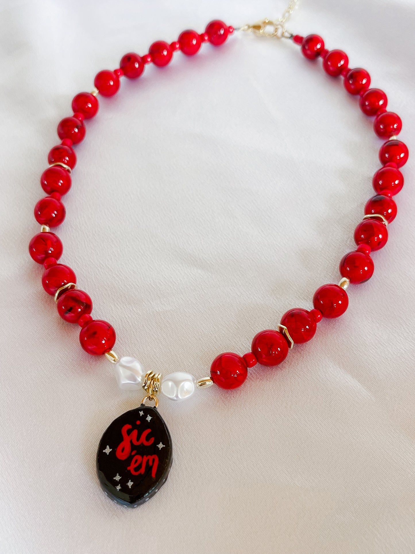 Red “Sic ‘em” necklace