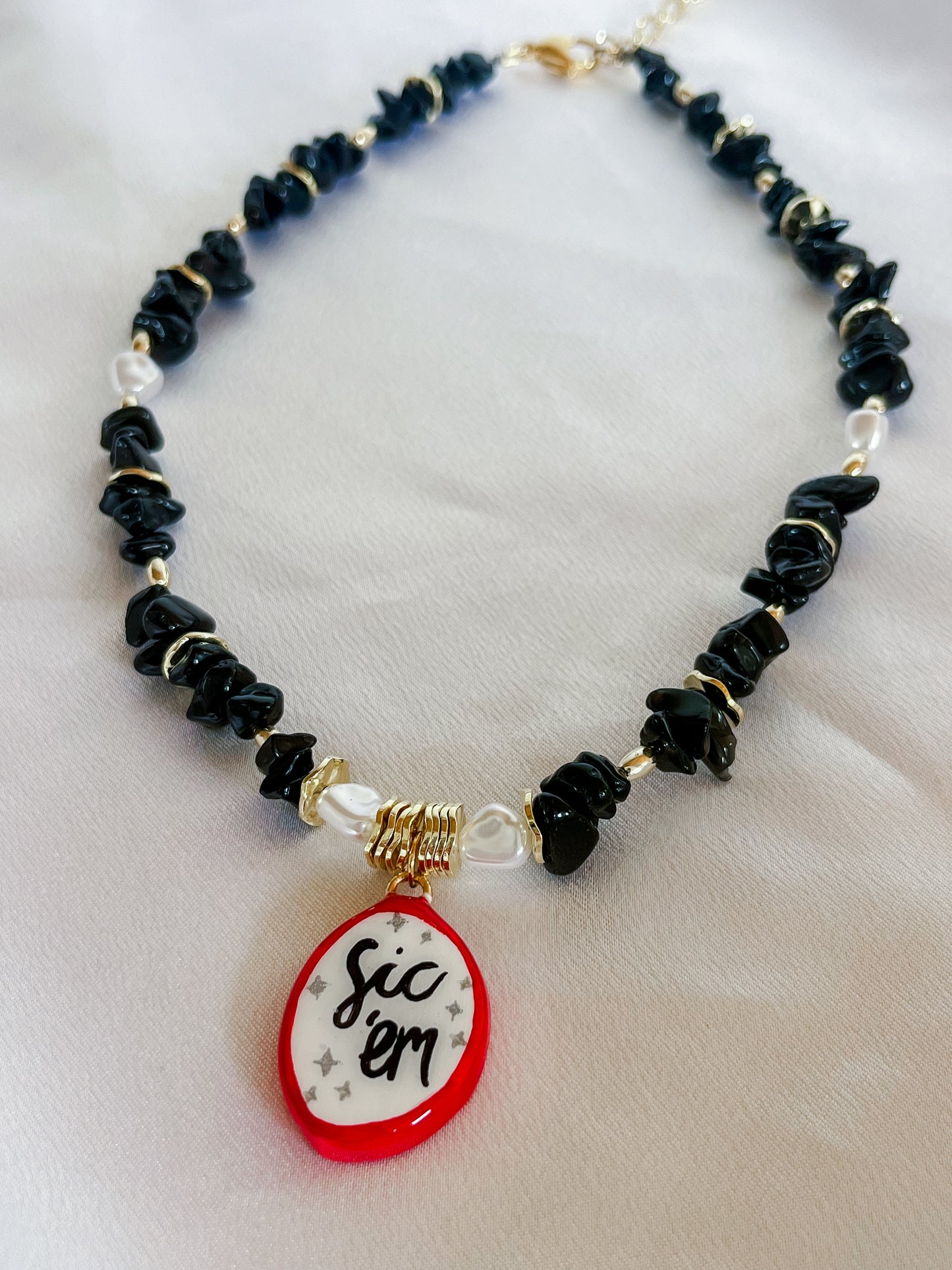 Black “Sic ‘em” necklace