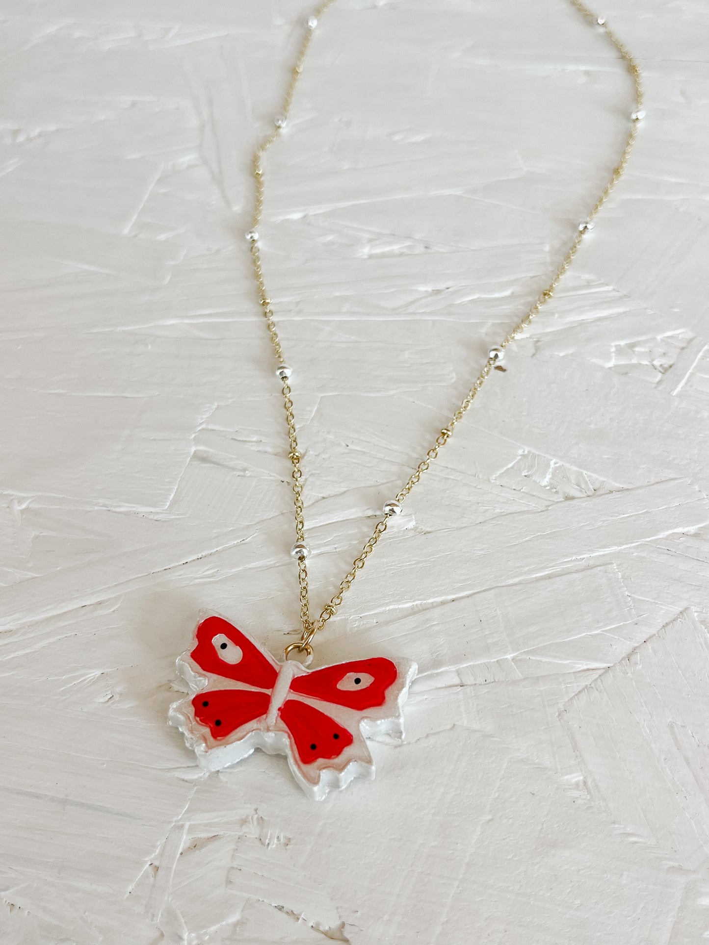 Red butterfly necklace
