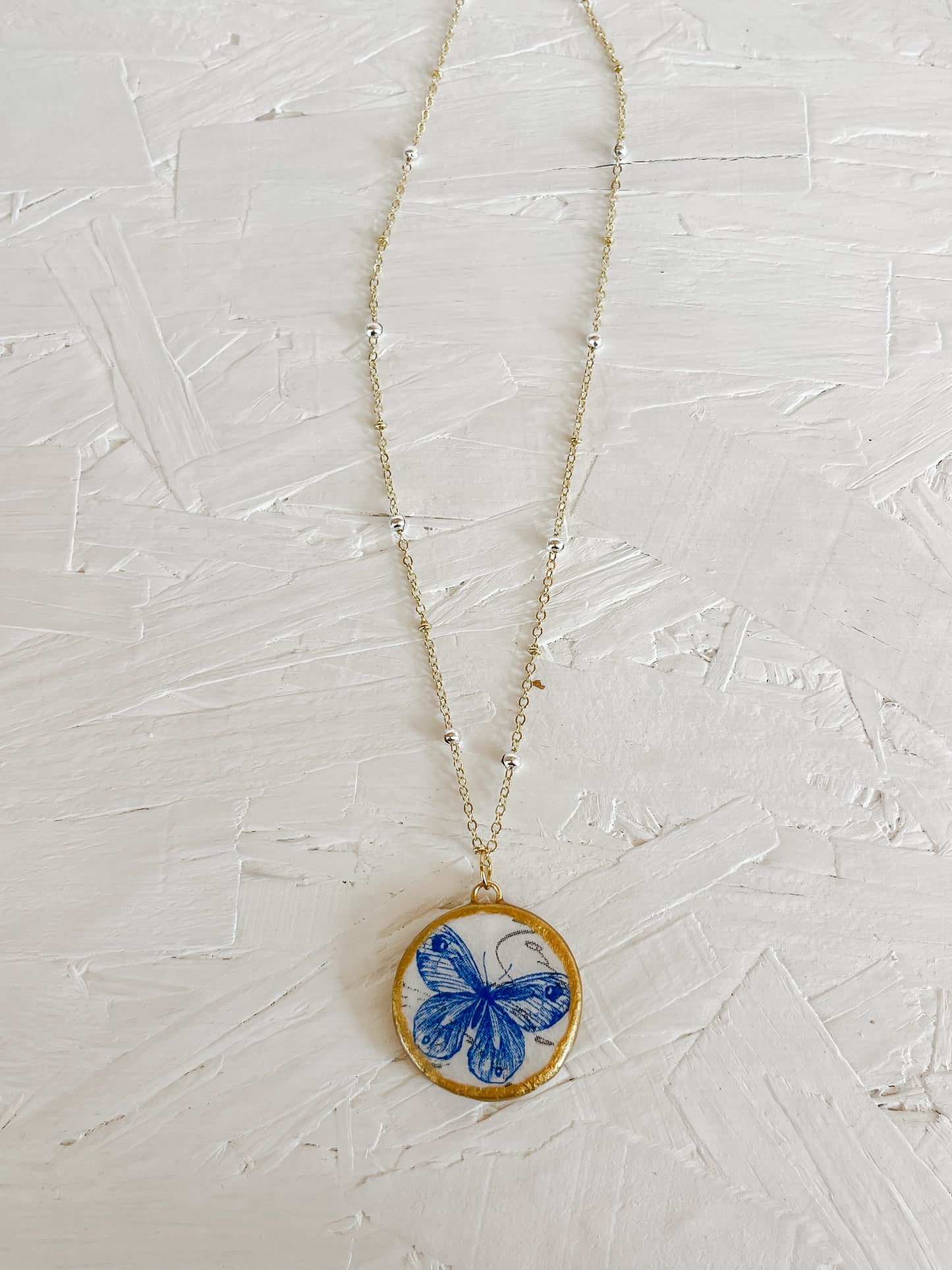 Blue butterfly necklace
