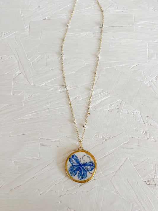 Blue butterfly necklace