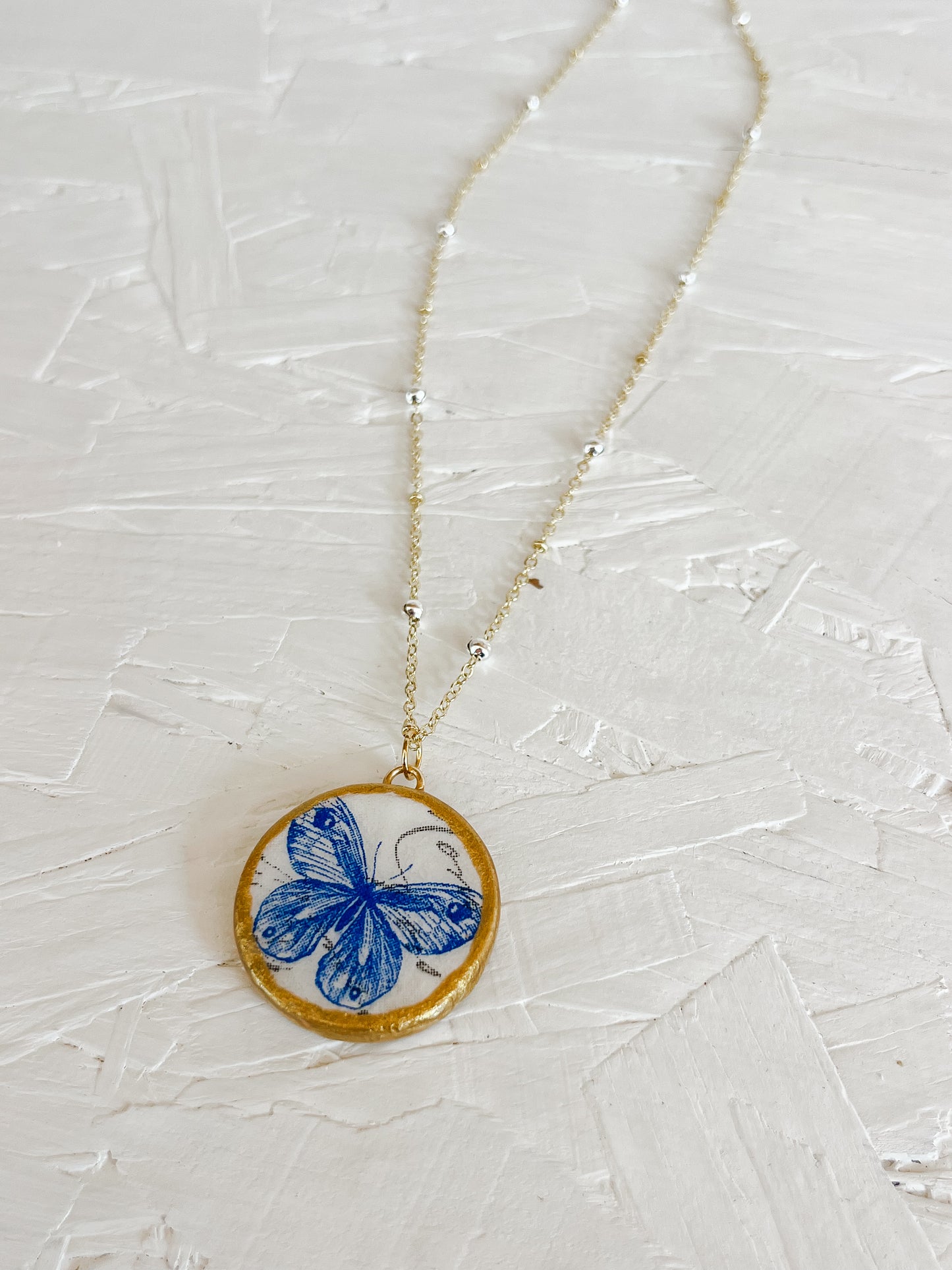 Blue butterfly necklace